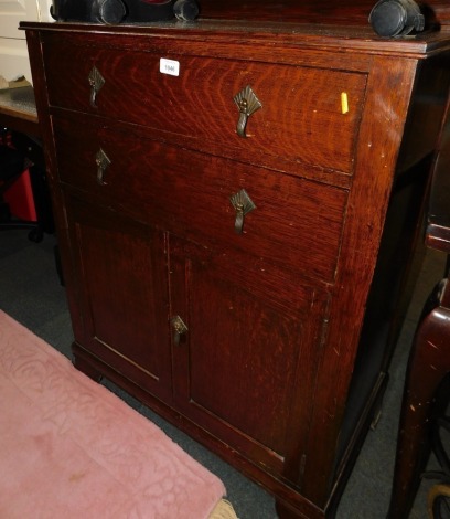 An early 20thC oak linen cupboard, with two drawers.