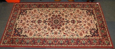 A Keshan runner, with central flower head medallion and repeating border.