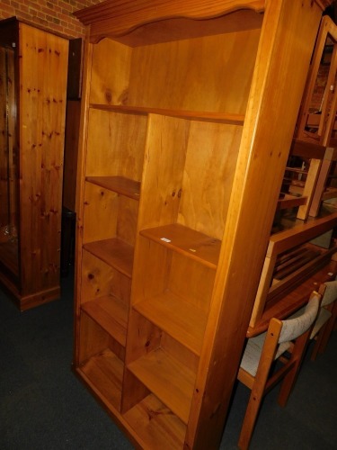 A pine compartmentalised bookcase, with fixed shelves.