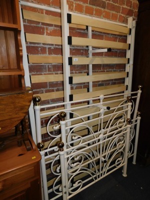 A Victorian style cream metal double bed frame, together with a matching single bed frame. (2)