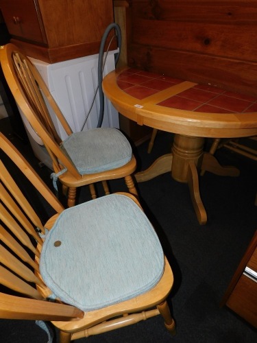 A beech extending kitchen table, with a terracotta coloured tile top and four hoop back chairs. (5)