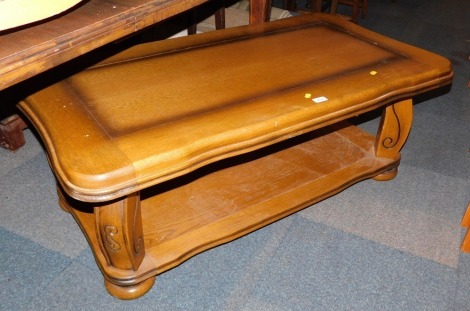 An oak coffee table, with under shelf.