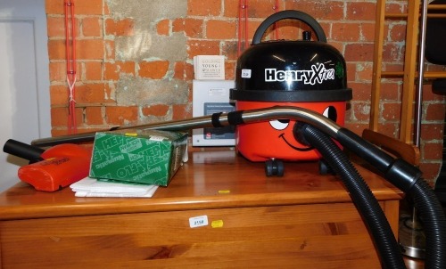 A Henry Xtra vacuum cleaner with filter bags. 2