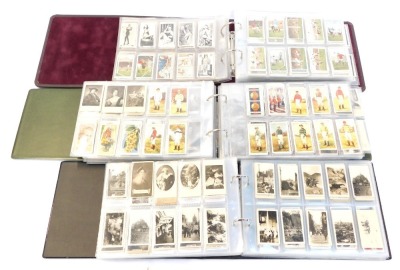 Three albums of cigarette tea and trade cards, Football Players, Vintage Cars, Franklins, Ogdens, Gallaghers, and others.