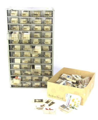 Cigarette trade and tea cards, John Players & Sons loose cards, Wills cigarette card set in metal shelving unit, 52cm high, 30cm wide, 17cm deep.