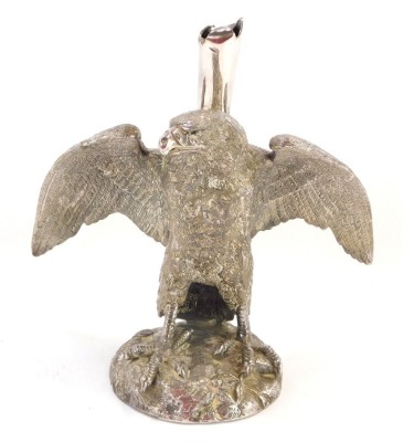 A silver plated eagle epergne stand, perched on a rock with fluted top, faint stamp to underside, 20cm high.