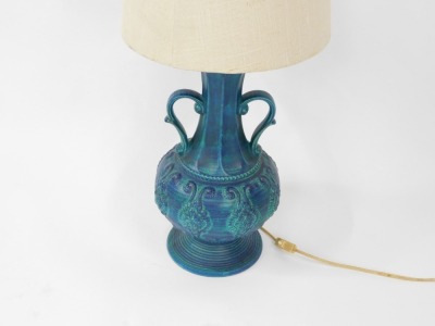 A Western Germany turquoise table lamp, with two handled vase and cream shade, the base 41cm high. (AF) WARNING! This lot contains untested or unsafe electrical items. It is supplied for scrap or re-conditioning only. TRADE ONLY - 2