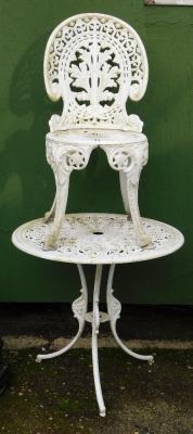 A Coalbrookdale style white painted cast iron bistro table and single chair, the table 62cm high, 69cm diameter. (2)