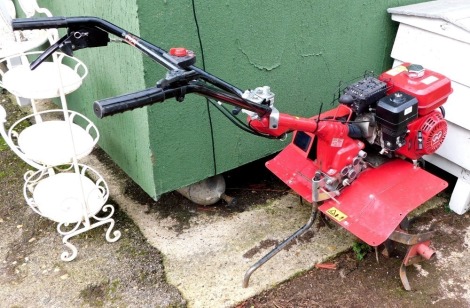 A Honda FE500 petrol tiller, 57kg, 3.6kw.