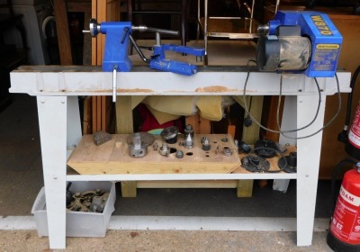 A Charnwood woodworking lathe, model W870, together with various chucks, cutters, wheels, etc, 170cm long.