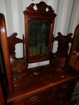 A Victorian walnut double wardrobe and dressing chest, by Blair and Kemp, Horncastle, the wardrobe with outswept pediment over a pair of carved and mirror set doors, the doors opening to reveal hanging hooks over a pair of deep drawers raised on a plinth - 2