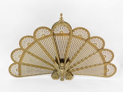 A pair of brass fireside fan guards, each with a phoenix centre and nine fan section, 64cm high, 93cm wide. (2) - 2