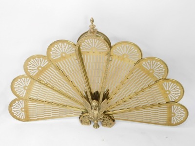 A pair of brass fireside fan guards, each with a phoenix centre and nine fan section, 64cm high, 93cm wide. (2) - 3