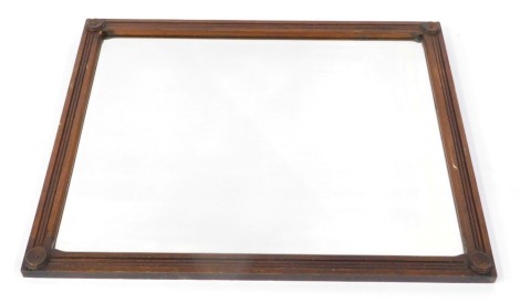 A Victorian oak framed wall mirror, rectangular mirror within a circular capped, reeded frame, 83cm x 68cm.