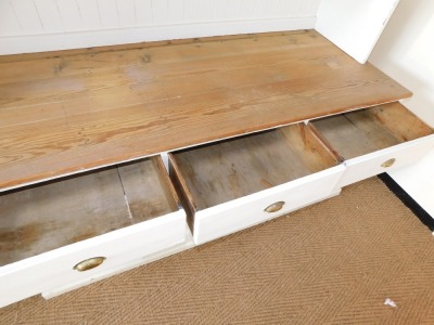 A Victorian painted pine kitchen dresser, the dresser back with a moulded cornice above two waterfall shelves, painted in white with a substantial three plank pine top, above arrangement of three drawers over a pair of twin cupboard doors, the base painte - 5