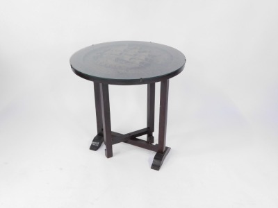 A mid 20thC Chinese tilt top occasional table, the circular top carved with a central ship in rough seas, glass protector, on an out folded base, 60cm diameter, 90cm high. - 2