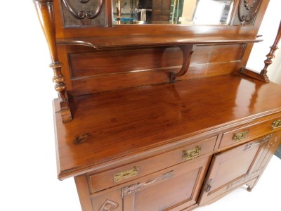 A Victorian Art Nouveau mahogany mirror back sideboard, the mirror backed top with floral panels, and single shelf with turned column supports, above two drawers and two doors, raised on turned feet, 197cm high, 152cm wide, 55cm deep. - 2