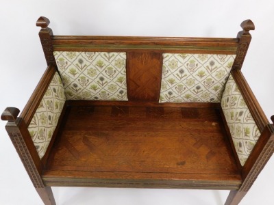 A Victorian oak and brass inlaid hall chair, with upholstered back and sides with carved panels and brass inlays, marquetry seat, on tapered, square legs, 92cm high, 96cm wide, 50cm deep. - 2