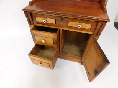 A Victorian oak washstand, the crenelated gallery over an arrangement of four small drawers and a cupboard, varying staining and colouring, raised on block feet, 90cm high, 76cm wide, 40cm deep. - 3