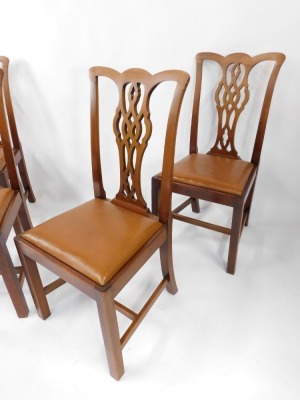 A set of four mahogany Chippendale style single dining chairs, each with a pierced splat, on H frame base, with tan leatherette drop in seats, 100cm high, 50cm wide. - 2