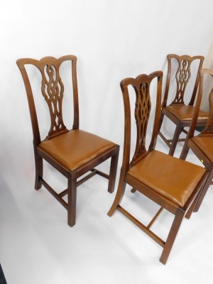 A set of four mahogany Chippendale style single dining chairs, each with a pierced splat, on H frame base, with tan leatherette drop in seats, 100cm high, 50cm wide. - 3