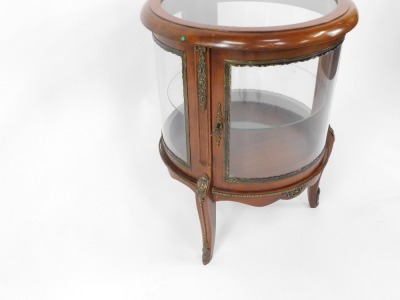 A Louis XV style mahogany bijouterie table, of circular form with brass mounts, with glazed top and sides, glass internal shelf, raised on cabriole legs , 74cm high, 56cm diameter. - 3