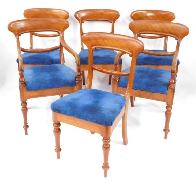 A set of early Victorian mahogany dining chairs, with blue upholstered overstuffed seats, raised on turned legs, comprising a pair of carvers and four single chairs.