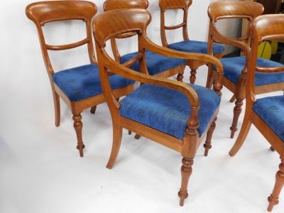 A set of early Victorian mahogany dining chairs, with blue upholstered overstuffed seats, raised on turned legs, comprising a pair of carvers and four single chairs. - 3