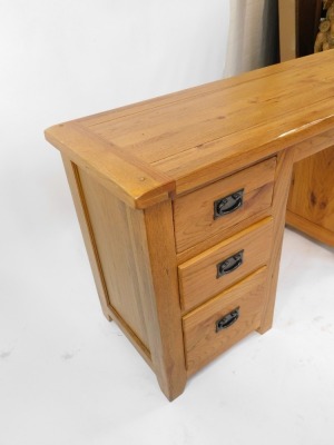 A modern oak twin pedestal desk, with a solid top over a pair of three drawer pedestals, 76cm high, 145cm wide, 49cm deep. - 3