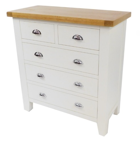 A modern oak and cream painted chest of drawers, with two short and three long drawers, on out splayed legs, 95cm high, 90cm wide, 42cm deep.