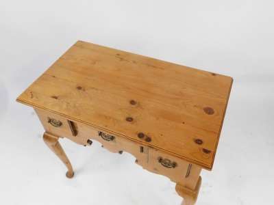 A Georgian style pine low boy, with two deep and one short central drawer, raised on cabriole legs, 71cm high, 76cm wide, 43cm deep. - 2