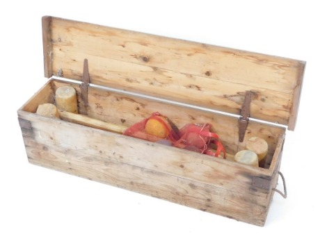 A vintage croquet set, with five mallets and four balls, in a pine carry box, 27cm high, 96cm wide, 23cm deep.