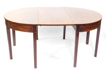 A George III mahogany D end dining table, with one additional leaf, raised on tapering square legs, 71cm high, 120cm wide, 116cm deep, 166cm deep extended.