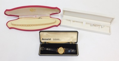 A group of jewellery, comprising an Accurist ladies wristwatch, with oval plain dial in a gold plated case, a silver heart ling necklace and bracelet set and a silver and past stone set faux pearl necklace. (3)