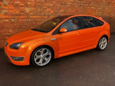 A 2006 Ford Focus ST-2 Sports 5-door Hatchback, registration WU56 OYJ, 2500cc in line five cylinder, c/w Ford Approved Mountune upgrade to 260bhp, ASBO orange with black roof, 132,911 recorded miles with full MOT (current to expire 6th January 2023) and s - 9
