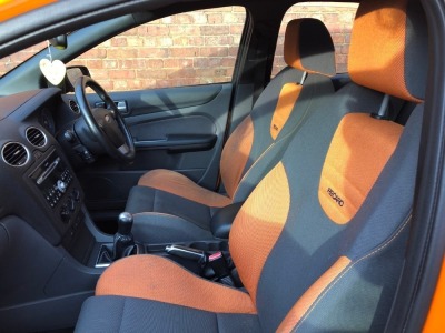 A 2006 Ford Focus ST-2 Sports 5-door Hatchback, registration WU56 OYJ, 2500cc in line five cylinder, c/w Ford Approved Mountune upgrade to 260bhp, ASBO orange with black roof, 132,911 recorded miles with full MOT (current to expire 6th January 2023) and s - 11