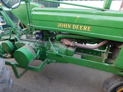 A 1941 John Deere Agricultural Tractor, registration JE 6347, diesel, first registered 31/12/1941, V5 present, later restored, together with a group of accessories comprising a John Deere AN tool kit, socket for cylinder head nuts, wrench for connecting r - 9