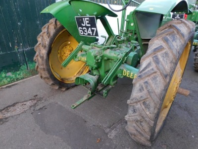 A 1941 John Deere Agricultural Tractor, registration JE 6347, diesel, first registered 31/12/1941, V5 present, later restored, together with a group of accessories comprising a John Deere AN tool kit, socket for cylinder head nuts, wrench for connecting r - 10