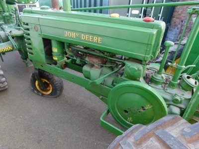 A 1941 John Deere Agricultural Tractor, registration JE 6347, diesel, first registered 31/12/1941, V5 present, later restored, together with a group of accessories comprising a John Deere AN tool kit, socket for cylinder head nuts, wrench for connecting r - 12