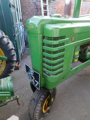 A 1941 John Deere Agricultural Tractor, registration JE 6347, diesel, first registered 31/12/1941, V5 present, later restored, together with a group of accessories comprising a John Deere AN tool kit, socket for cylinder head nuts, wrench for connecting r - 13