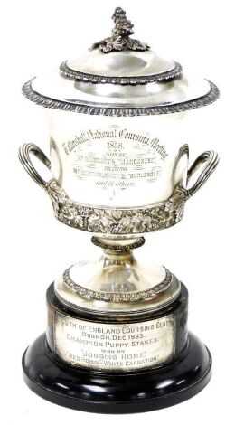 A George III silver campana shaped two handled trophy and cover, embossed with a band of vines, the collar and foot with acanthus leaf band, the lid similarly decorated with a vine finial, gilt interior, later presentation engraved 'Tattershall National C