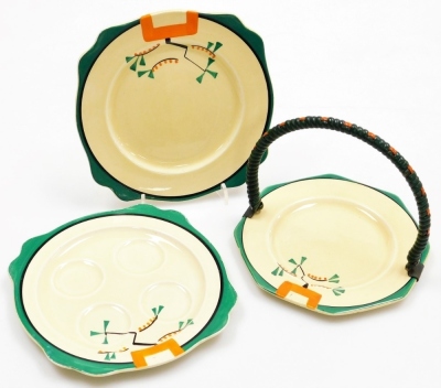 A group of Clarice Cliff Bizarre Ravel pattern wares, comprising four division egg cup stand, 16cm wide and two associated egg cups, 5.5cm high, pepper pot, 8cm high, cheese dish and cover, 19cm wide, jar, 7.5cm high (lacking lid), octagonal sandwich plat - 2