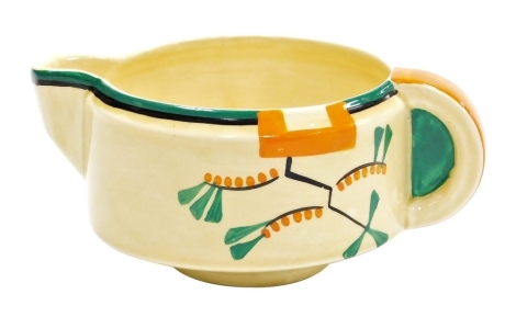 A Clarice Cliff Bizarre Ravel pattern jug, hand painted with an abstract design in green, orange and black against a pale yellow ground, printed marks, no.5799, 7cm high