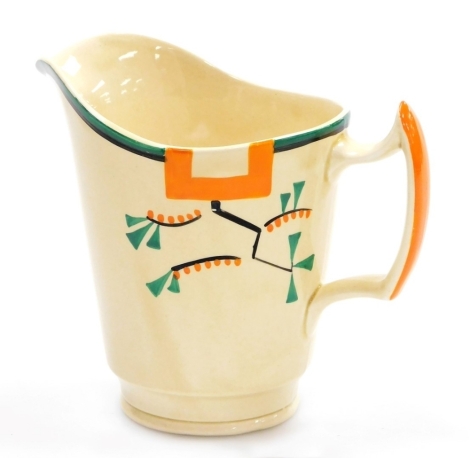 A Clarice Cliff Bizarre Ravel pattern jug, with a shaped handle, hand painted with an abstract design in green, orange and black against a pale yellow ground, printed marks, 14cm high.