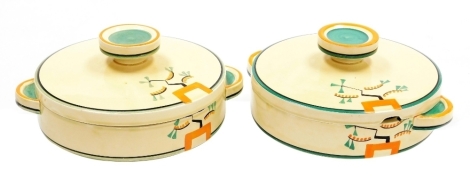 Two Clarice Cliff Bizarre Ravel pattern large tureens, both pieces hand painted with an abstract design in green, orange and black against a pale yellow ground, printed marks, 23cm wide including handles.