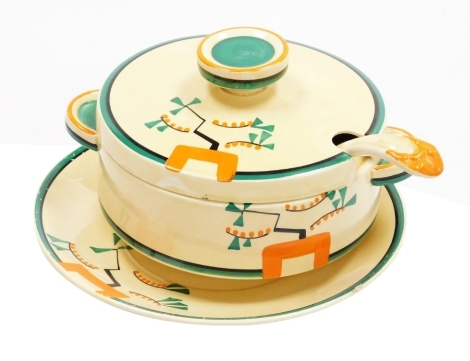 A Clarice Cliff Bizarre Ravel pattern sauce tureen and cover, ladle and stand, each piece hand painted with an abstract design in green, orange and black against a pale yellow ground, printed marks, tureen 18cm wide.