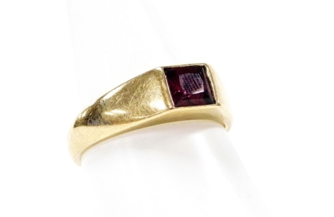 A 9ct gold dress ring, with square set amethyst, in a rub over setting, ring size M, 3.7g all in.