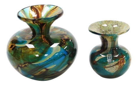 A 20thC Mdina glass vase, of shouldered form with a flared rim, with swirled green and amber coloured glass centre, marks to base, 13cm high, and a similar vase, bearing label and marks to underside, 9.5cm high