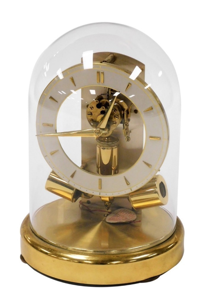 A Junghans 1000 day electric clock with visible escapement