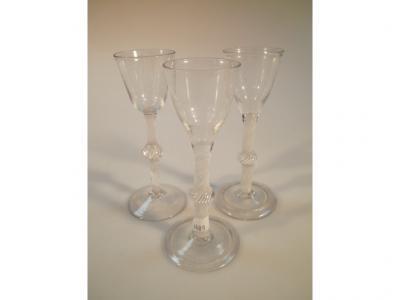 Three 18thC ale glasses with ribbon twist stems